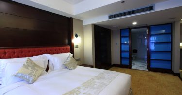 modern hotel room with king size bed