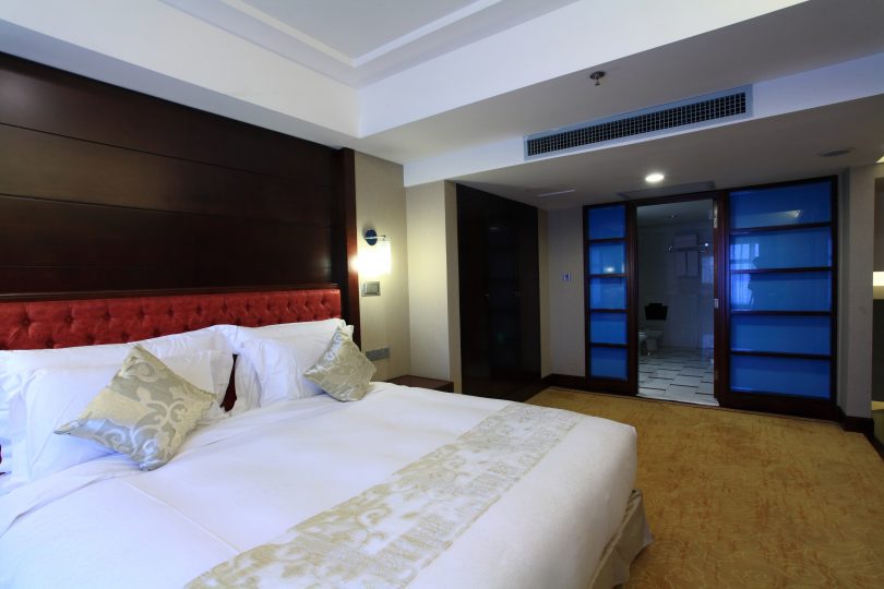modern hotel room with king size bed